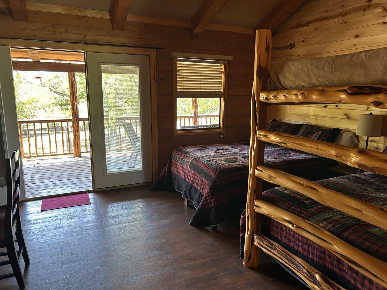 Combination kitchenette and bathroom vanity area at Sabinal River Lodge with light knotty-pine cabinets